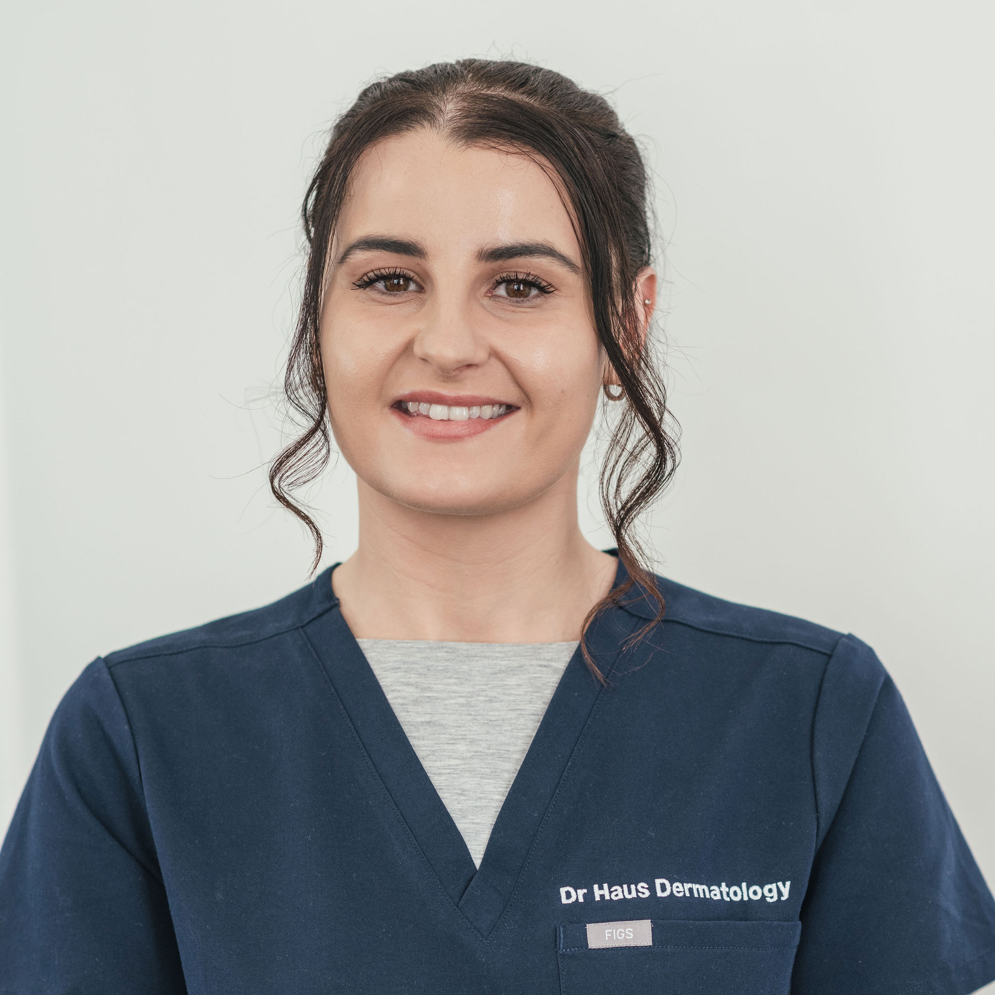 Smiling woman in medical uniform