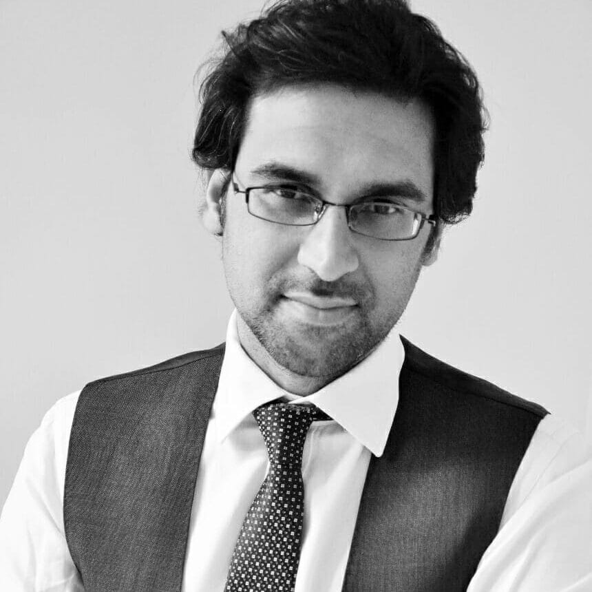 Male Dermatologist wearing tie and glasses